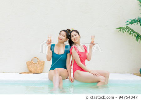 summer vacation trip with friends concept series_korean beautiful asian young women drinking champagne summer vacation trip with friends concept series_korean beautiful asian young women drinking champagne 94754047