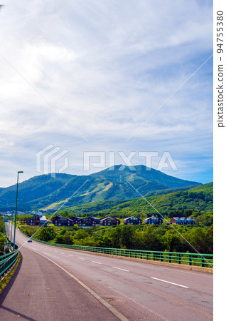 St. Moritz Ohashi leading to the resort area of Niseko and the majestic Niseko Annupuri｜Kutchan, Hokkaido 94755380