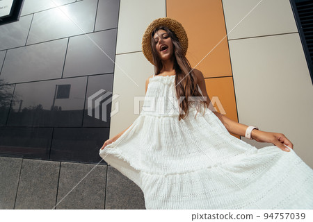 Cute young woman laughing at the camera 94757039