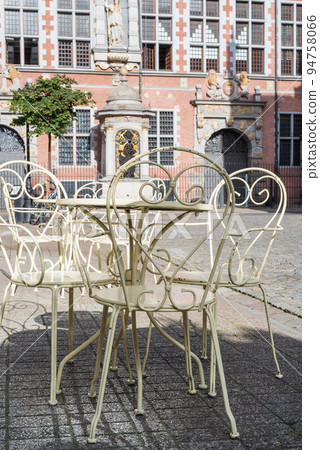 Empty coffee table in center of old european town Empty coffee table in center of old european town 94758066