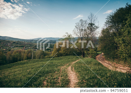 A train on a lush green field A train on a lush green field 94759051