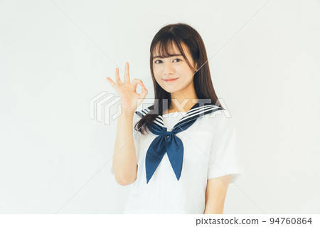 High school student doing an okay sign 94760864