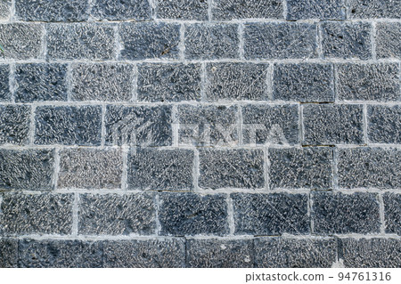 Light gray, white bricks on the wall decoration for background. Stone brick wall textures. Light gray, white bricks on the wall decoration for background. Stone brick wall textures. 94761316