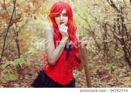 Beautiful woman witch with broom. 94762554