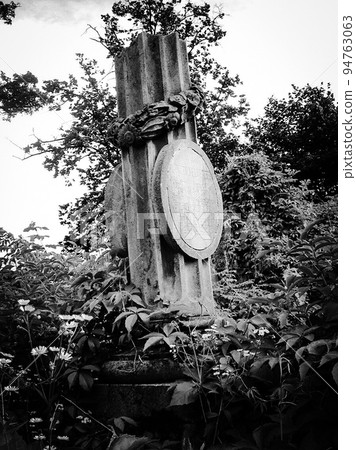 Old abandoned Jewish cemetery with stone graves between trees Old abandoned Jewish cemetery with stone graves between trees 94763063