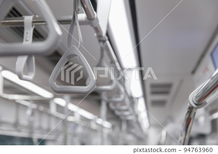 Handles for standing passenger inside in the subway train. Handles for standing passenger inside in the subway train. 94763960
