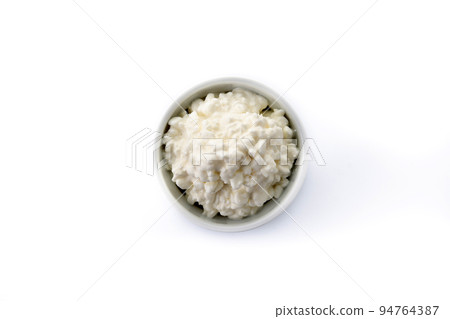Fresh cottage cheese isolated on white background. Top view. Fresh cottage cheese isolated on white background. Top view. 94764387