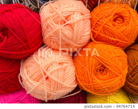 Balls of yarn for knitting. The concept of needlework and knitting. Selective focus Balls of yarn for knitting. The concept of needlework and knitting. Selective focus 94764714
