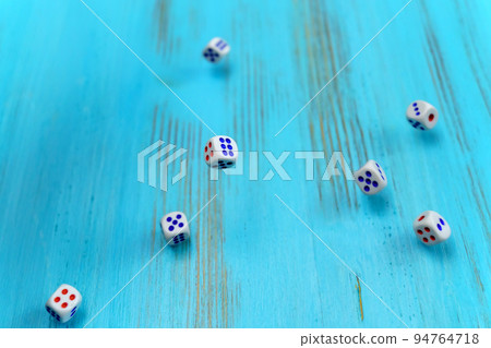 Dice on the blue wooden playing field. Luck and excitement. Concept Board games strategy 94764718