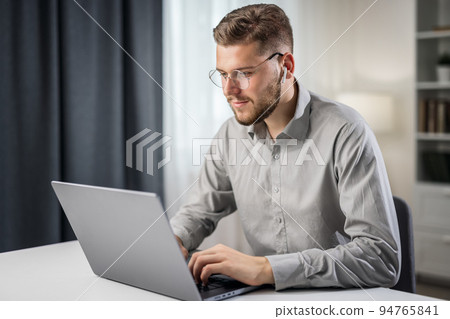 Young bearded programmer 94765841