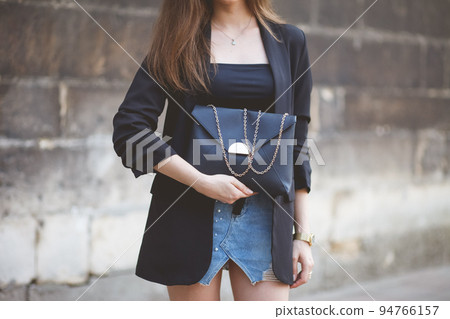 Girl demonstrates her new bag bought in a store. 94766157