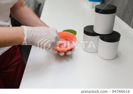 Face cosmetics. Jars of cream, serum and face mask on the table. Procedures salon concept. Minimalism... 94766616