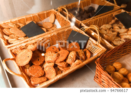 Variety of cookies on the counter of a pastry shop. Pastries in a baking shop. Variety of cookies on the counter of a pastry shop. Pastries in a baking shop. 94766617