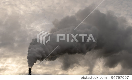 Smoking chimneys of a chemical plant emitting huge amounts of greenhouse gases.Air environment pollution concept. 94767007