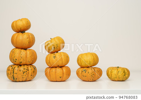 Pumpkins on white isolated background. Yellow autumn harvest pumpkins on empty backdrop. Fall holidays, halloween, thanksgiving day, food concept. 94768083