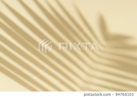 Palm shadow on an empty light wall. Tropical sunny background for presentation of beauty products, spa, cosmetics. Overlay effect. Palm shadow on an empty light wall. Tropical sunny background for presentation of beauty products, spa, cosmetics. Overlay effect. 94768103