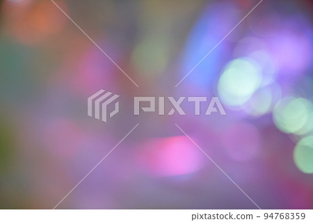 Blurry holographic abstract background in pink tones. Unfocused holographic colors of mother-of-pearl foil. Holographic iridescent abstract background made of rainbow foil. High quality photo 94768359