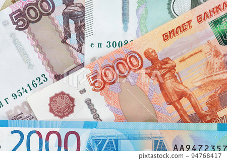 Russian rubles background. Money background and texture. Banknotes of different denominations Russian rubles background. Money background and texture. Banknotes of different denominations 94768417