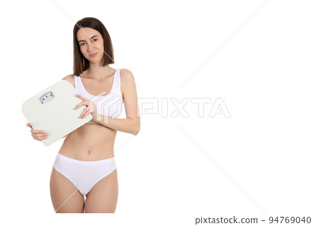 Concept of weight loss with thin girl, isolated on white background 94769040