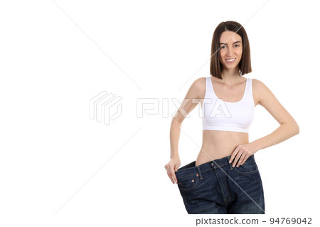 Concept of weight loss with thin girl, isolated on white background 94769042
