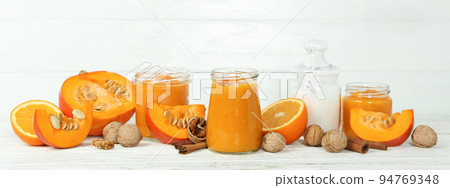 Concept of tasty food, pumpkin jam on white wooden table 94769348