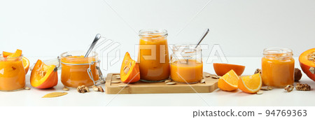 Concept of tasty food, pumpkin jam on white table Concept of tasty food, pumpkin jam on white table 94769363
