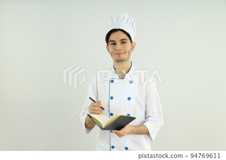 Concept of cooking, young man chef on light background 94769611