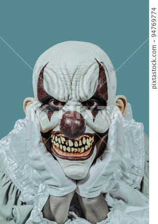 mad evil clown with a creepy smile 94769774