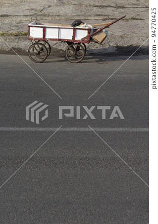 Handcart at street- urban scene Handcart at street- urban scene 94770425