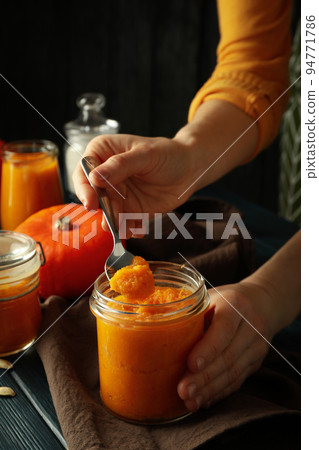 Concept of tasty food with pumpkin jam Concept of tasty food with pumpkin jam 94771786