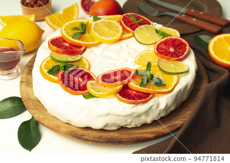 Concept of tasty dessert with meringue pie with citrus, closeup Concept of tasty dessert with meringue pie with citrus, closeup 94771814