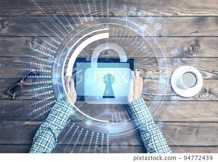Concept of computer access with media lock icon on tablet screen Concept of computer access with media lock icon on tablet screen 94772439