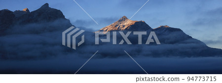 Sunlit peak of Mount Oldehore in early morning. Sunlit peak of Mount Oldehore in early morning. 94773715