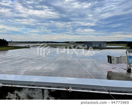 The rooftop of the Misawa Airport building adjacent to Misawa Air Base = View of the apron for commercial aircraft from the pick-up deck. Beyond that is an electric gate. The rooftop of the Misawa Airport building adjacent to Misawa Air Base = View of the apron for commercial aircraft from the pick-up deck. Beyond that is an electric gate. 94773969