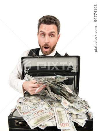 financial support. investment. shocked businessperson with money case. 94774198