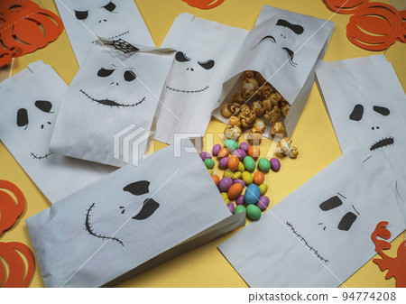 preparing Halloween treats for children preparing Halloween treats for children 94774208