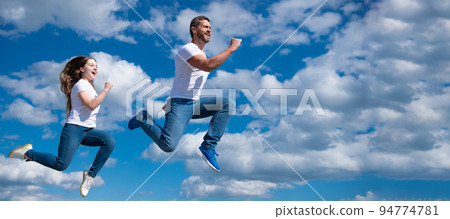 Father and daughter jump on sky, banner with copy space. father and daughter jump high. hurry up. happy childhood and fatherhood. concept of friendship Father and daughter jump on sky, banner with copy space. father and daughter jump high. hurry up. happy childhood and fatherhood. concept of friendship 94774781