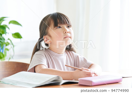 girl thinking while studying at home girl thinking while studying at home 94774990