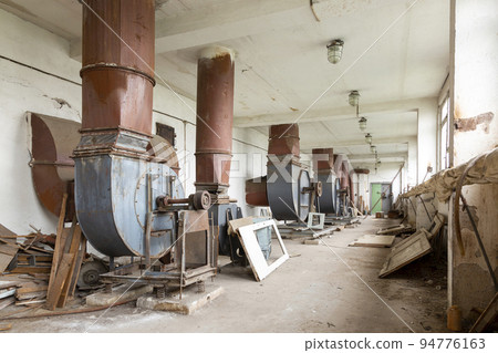 An old abandoned hall with ventilation equipment An old abandoned hall with ventilation equipment 94776163