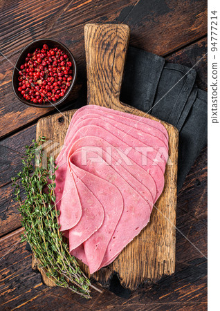 Sliced Beef Ham snack on wooden board. Wooden background. Top view Sliced Beef Ham snack on wooden board. Wooden background. Top view 94777214