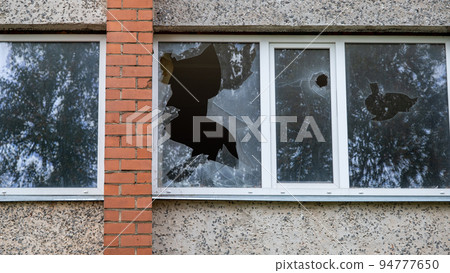 Broken glass in an abandoned house, abstract background 94777650