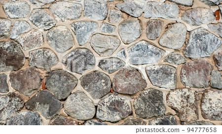 Close up stone and mortar wall for background. 94777658