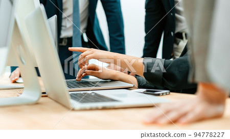 close up. the working group uses laptops to verify the data 94778227