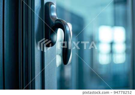 Doorknob with a lock on the glass door. Doorknob with a lock on the glass door. 94778252