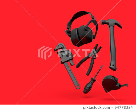 Flying view of black construction tools for repair on red background 94778384