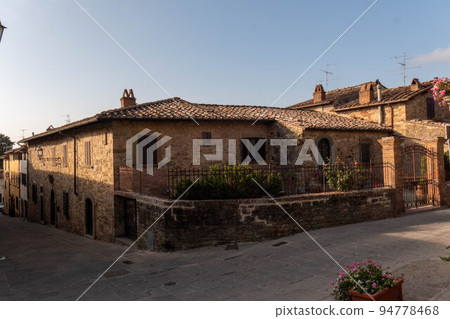 A quiet street of residential buildings in the historic medieval village of Panzano Tuscany 94778468