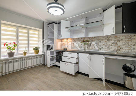 Renovated Interior for modern trendy white kitchen with doors open Renovated Interior for modern trendy white kitchen with doors open 94778833
