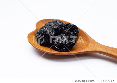 Dried prunes on white background Dried prunes on white background 94780047