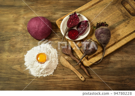 Purple dough bun for noodles with ingredients on the table. Purple dough bun for noodles with ingredients on the table. 94780228