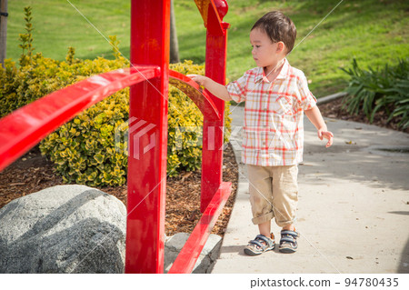 Young Chinese and Caucasian Boy Having Fun at the Park. 94780435